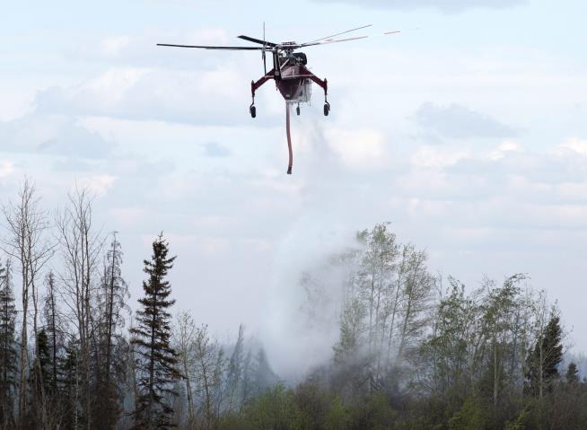 Canadian Officials Seek 'Death Grip' on Wildfire