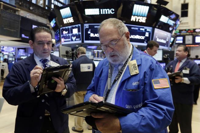 Dow Pulls Back From Record High