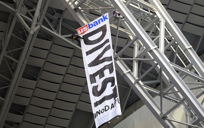Pipeline Protesters Hang Banner Over NFL Game