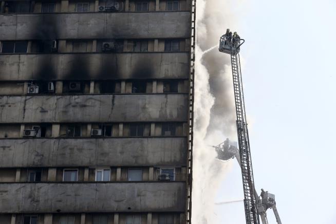 Burning High-Rise Falls, Kills 30 Firefighters