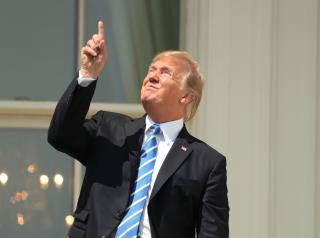 President Stares at Sun Without Glasses