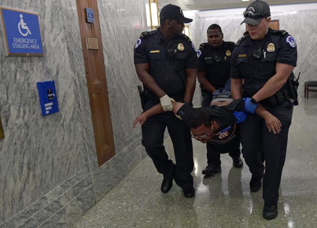 Protesters in Wheelchairs Dragged From Health Care Hearing