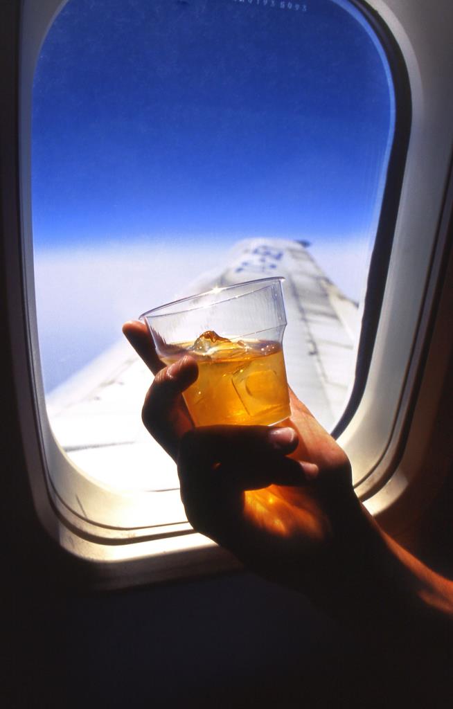 First-Class Flier Tries to Sneak Drinks to Pals, Pays the Price