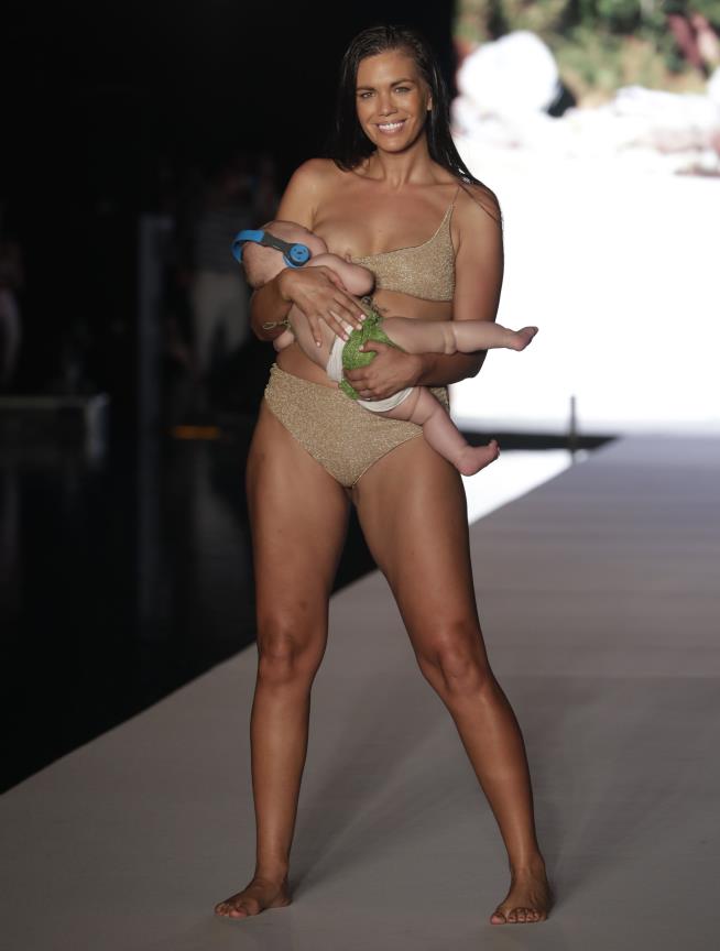 Model Walks the Runway While Breastfeeding