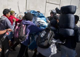 US Shuts Border, Hits Migrants With Tear Gas