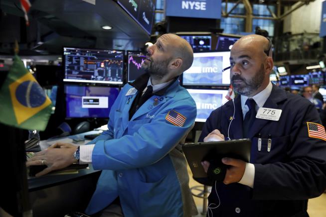 Dow Crosses 28,000 for First Time