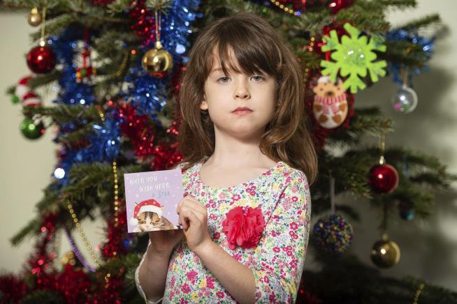 Scrawled in Girl's Christmas Card: 'Please Help Us'
