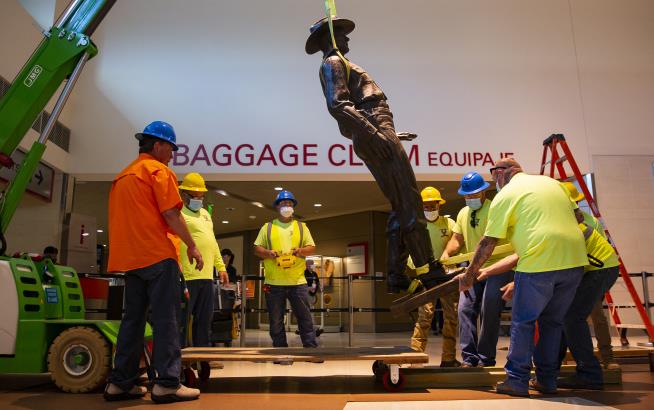 Racist Record Brings Down Airport's Texas Ranger Statue