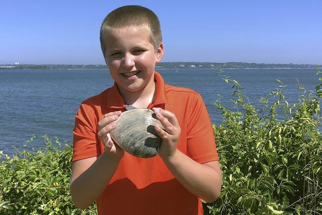 Boy Digs Up Mighty Big Mollusk While Clamming With Grandpa