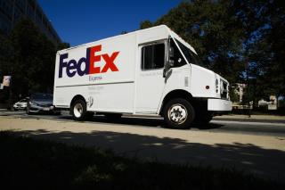 In this June 26, 2019, file photo, a FedEx truck drives in Philadelphia.   (AP Photo/Matt Rourke, File)