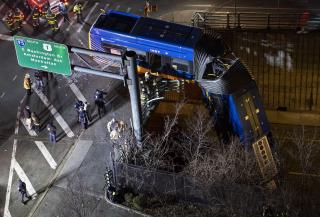 Crash Leaves Bus Dangling From NYC Overpass