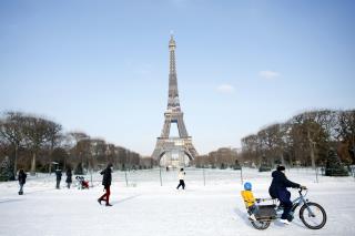 Blowtorch Being Used to Melt Eiffel Tower's Ice