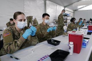 Vaccinations of Troops Overseas Lag