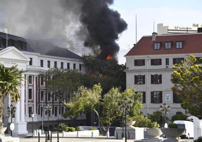 Fire Crews Work to Save Parliament
