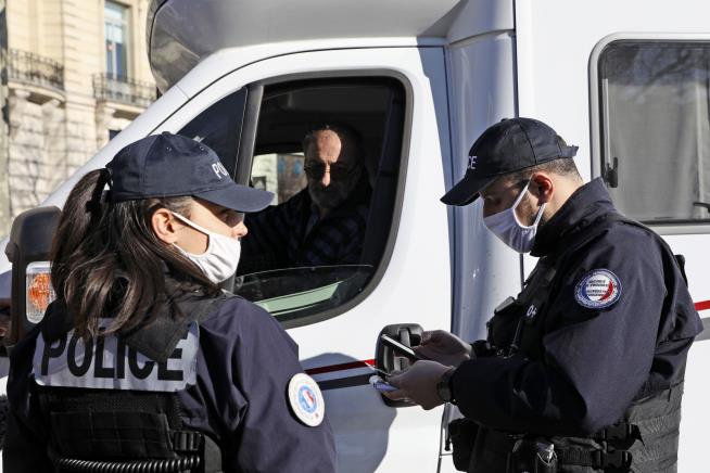In Paris, Convoy Blocks Champs-Elysees