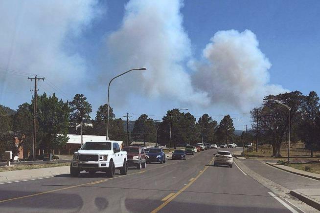 Wildfires Approach NM Village Like 'Pair of Tongs'