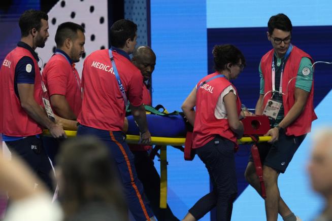 Olympic Swimmer Emerges From Pool, Collapses