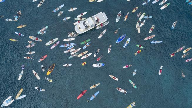 'Paddle Out' Ceremony Marks a Year Since Lahaina Wildfire