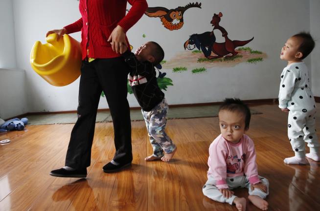 China Bars Foreigners From Adopting Its Own