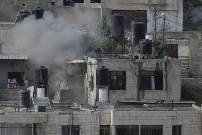 Israeli Soldiers Seen Pushing Lifeless Bodies Off Rooftops