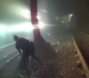 Cops Save Injured Man From Oncoming Train