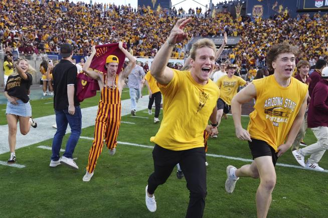 Goal Posts Go Back Up After Fans Rush Field Early