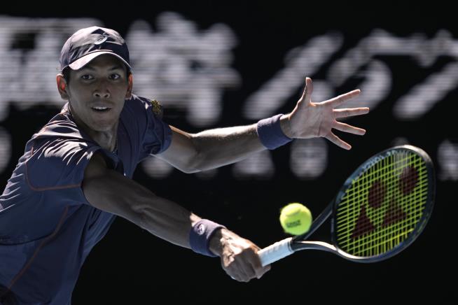 Tennis Star Smashes Ball, Racket, Camera