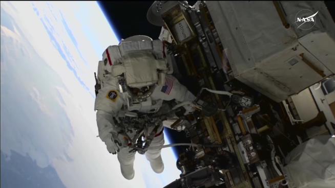 Stranded Astronauts Take First Spacewalk Together