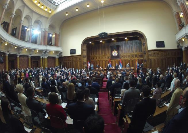 Smoke Bombs, Scuffles, Flares: Serb Parliament Has a Wild Day