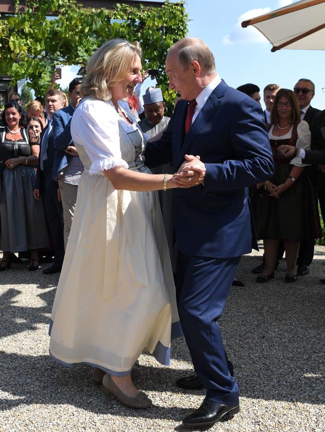 Official's Infamous Waltz With Putin Still Defines Her