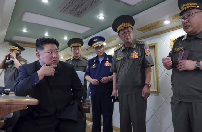 Kim Oversees Tests of New Defense Missiles