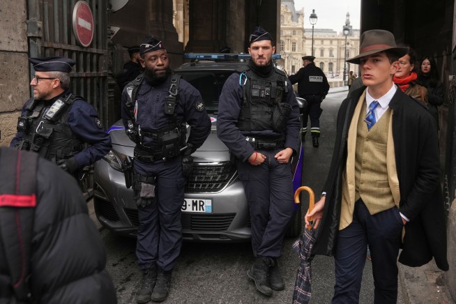 Viral 'Fedora Man' at Louvre Heist Is Just a Teen