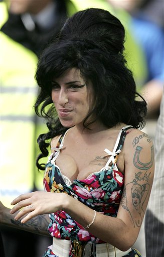 Convict Hubby Divorces Winehouse