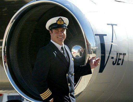 Travolta Lands Relief Jet in Haiti