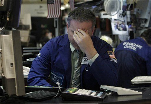 Dow Drops 228, Sinks Below 12,000