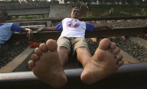 Indonesians Get Unconventional Medical Treatment From Lying on Train Tracks