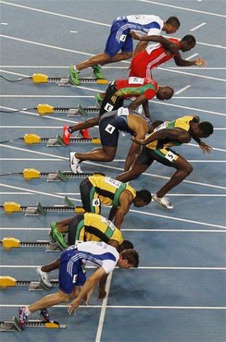 Usain Bolt Disqualified for False Start; 'Balderunner' Oscar Pistorius Advances to Semis in Men's 400 Meter