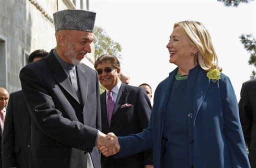 Clinton, Karzai Joke About Herman Cain