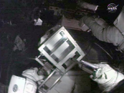 Spacewalking Astronauts Test Repair Goo