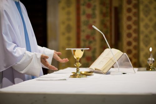 Priest and Lesbian Spark Culture Clash Over Holy Mass