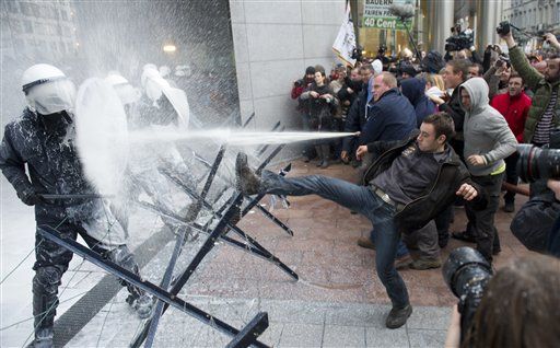 Protesting EU Farmers Spray Cops With ... Milk?