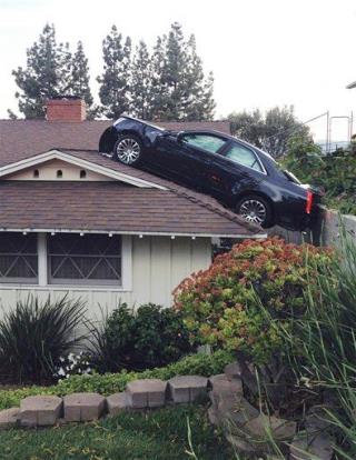 Guy's Car Ends Up on Neighbor's Roof