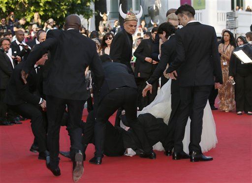 Man Dives Under Celeb's Dress on Cannes Red Carpet