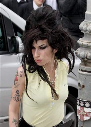 Winehouse 'Cautioned' After Night in Cell