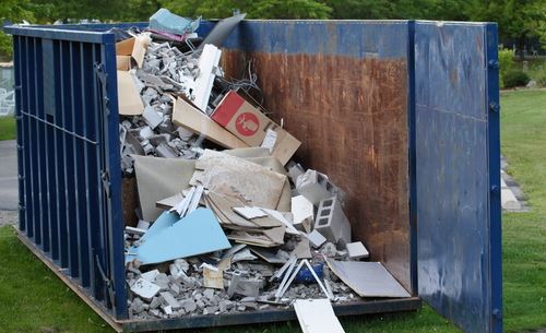 Hauler Dumps 2 Tons of Trash on Customer's Yard