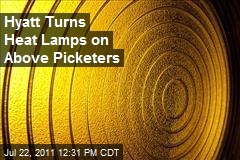 Hyatt Turns Heat Lamps on Above Picketers
