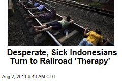 Indonesians Get Unconventional Medical Treatment From Lying on Train Tracks