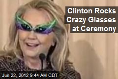 Clinton Rocks Crazy Shades at Ceremony