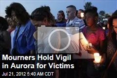 Mourners Hold Vigil in Aurora for Victims