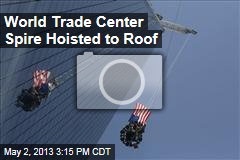 World Trade Center Spire Hoisted to Roof